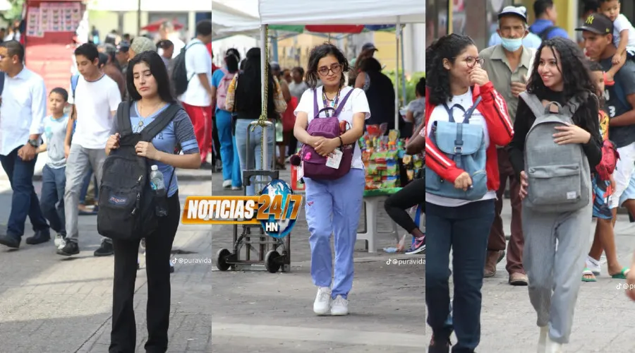 Por robos: Hondureños caminan con mochilas hacia adelante en centro de Tegucigalpa (VIDEO)